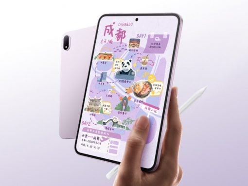 Hand holding a pink tablet displaying a colorful illustrated map with landmarks and icons.