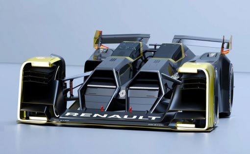 Futuristic Renault race car with black and gold accents, low-slung aerodynamic body and large rear wings, on a glossy surface.