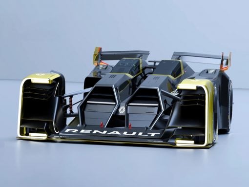 Futuristic Renault race car with black and gold accents, low-slung aerodynamic body and large rear wings, on a glossy surface.