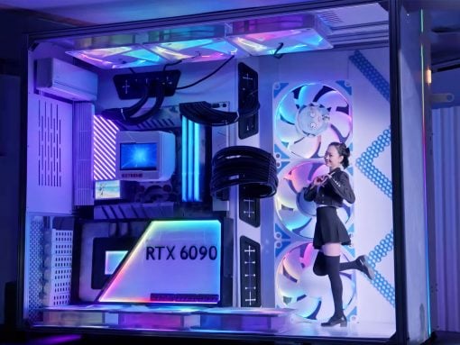 Person in a black outfit posing inside a neon-lit custom gaming PC case featuring an RTX 6090 graphics card and large cooling fans.