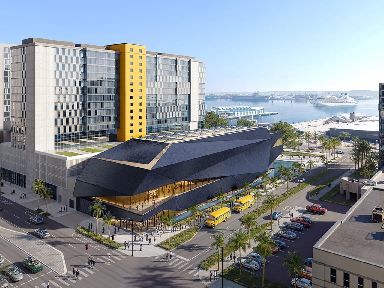 Modern waterfront complex with an angular dark-blue building, glass office tower with a yellow column, palm trees, and ships in the harbor.