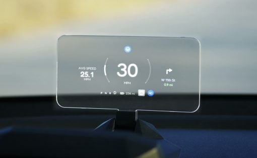 Head-up display showing 30 mph, avg 25.1 mph, and a turn onto W 11th St, 0.9 mi ahead.