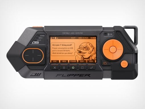 Handheld black portable Linux computer with orange UI, large right circular control, left thumb pad, and 'FLIPPER' label.