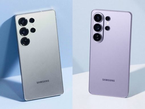 Two Samsung phones shown from the back with quad-camera modules, silver on the left and lavender on the right, against a light blue background.