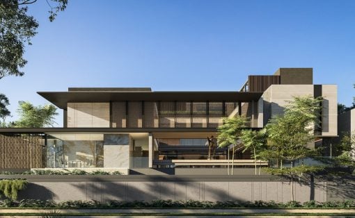 Modern two-story building with large glass walls, beige stone and wood panels, and a flat overhanging roof, set behind a low concrete wall with greenery