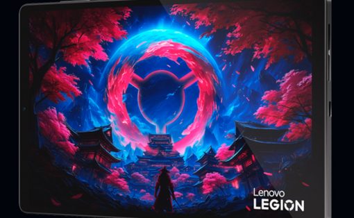 Lenovo Legion tablet displaying a vivid fantasy scene with a glowing pink circular portal above a temple village with pink trees.