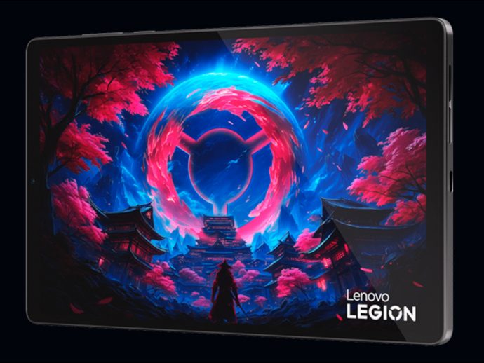 Lenovo Legion tablet displaying a vivid fantasy scene with a glowing pink circular portal above a temple village with pink trees.