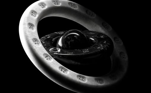 Abstract 3D sculpture: a white numbered ring looping around a glossy black inner core against a black background (artistic, geometric form).