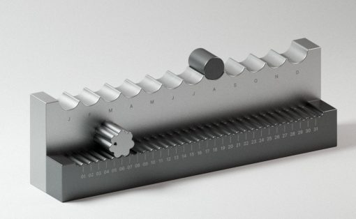 Metal calendar mechanism with a toothed roller and knob, months labeled along the top and a 01–31 scale along the base.