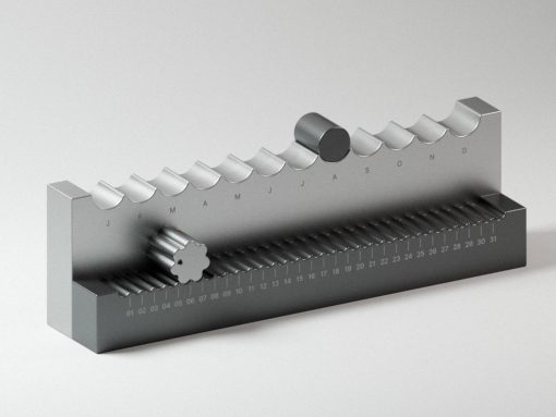 Metal calendar mechanism with a toothed roller and knob, months labeled along the top and a 01–31 scale along the base.
