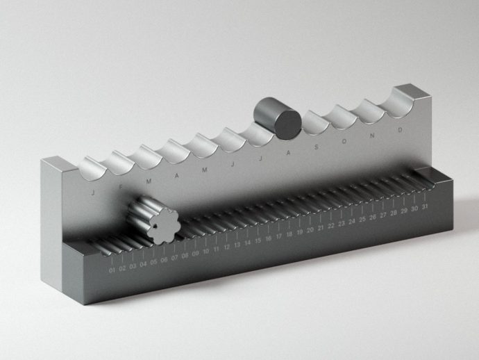 Metal calendar mechanism with a toothed roller and knob, months labeled along the top and a 01–31 scale along the base.