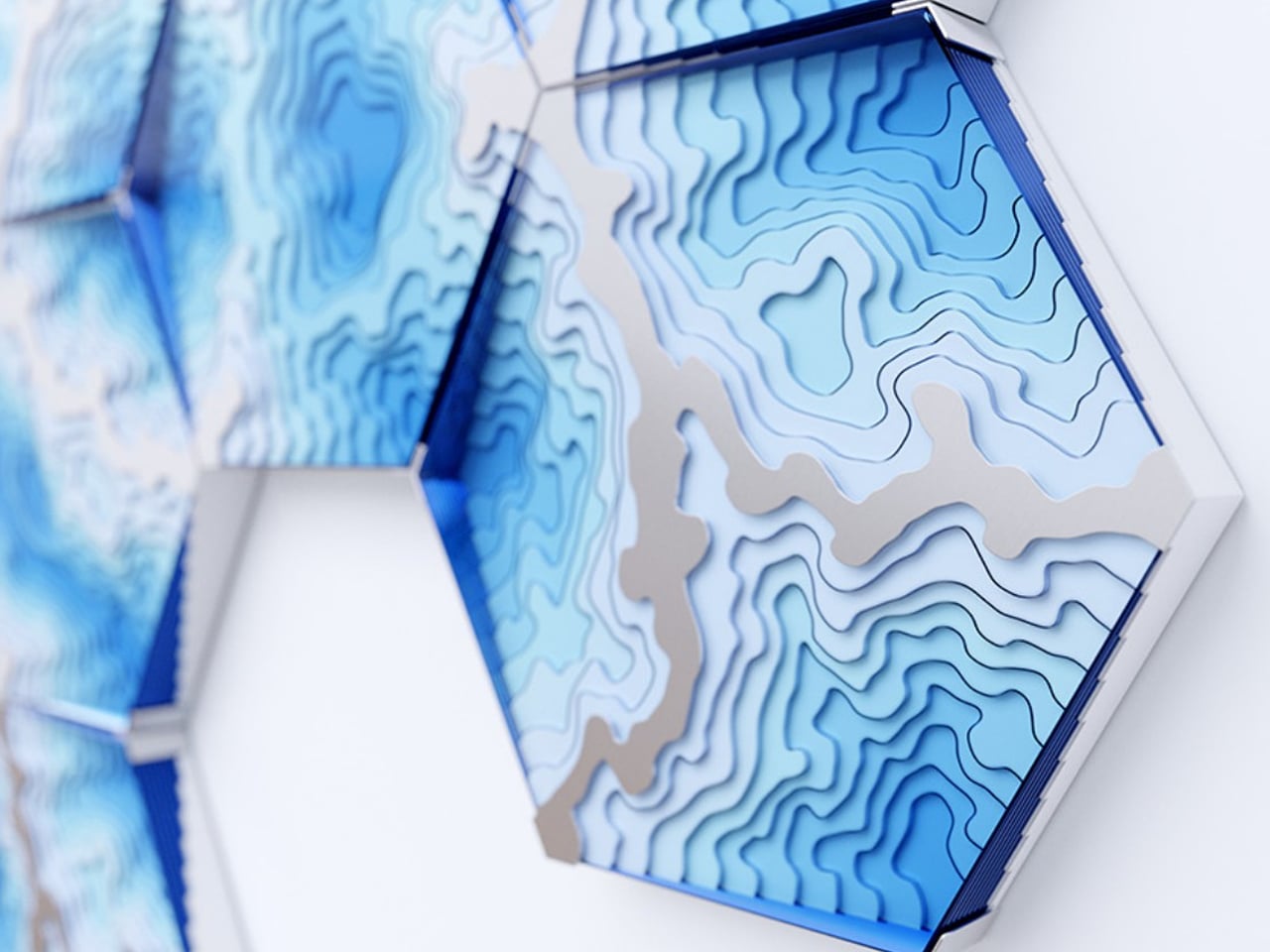Abstract blue hexagonal wall sculpture with layered contour patterns and 3D depth.