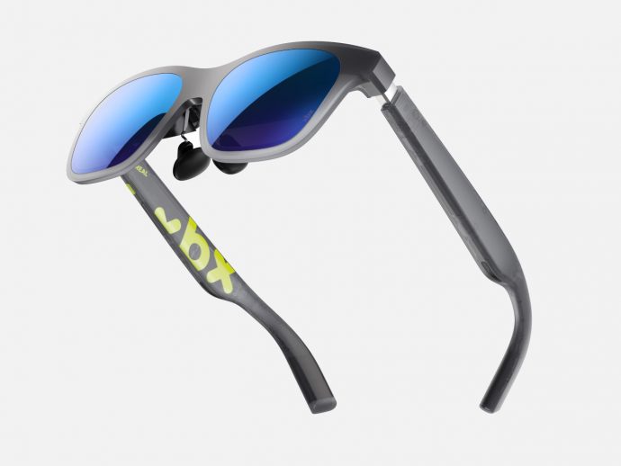 Xbox-branded gray sport sunglasses with blue mirrored lenses and curved arms, angled for a sleek athletic look