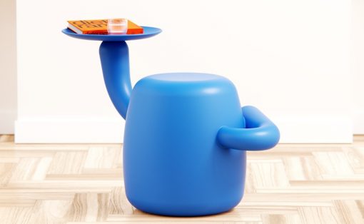 Blue rounded stool with a curved arm holding a small tray on top, which supports a book and a glass.