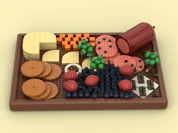 This LEGO Charcuterie Board Has Salami, Brie, Olives, and Chocolate and We Need It on a Store Shelf
