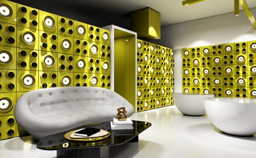 Modern lounge with bold yellow geometric wall panels, a white curved sofa, and a glossy black coffee table.