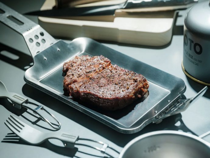 This Compact Grill Plate Cooks a Perfect Steak Over Any Heat Source & Packs Flat When You’re Done