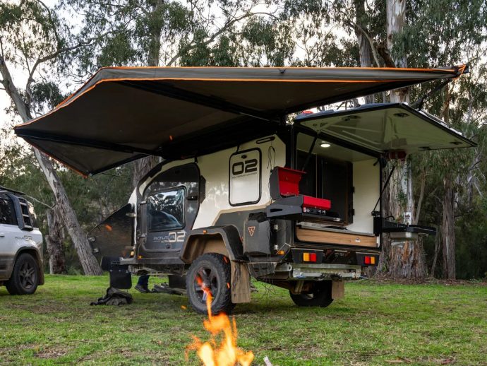 This teardrop camper’s wing-like awnings turn any campsite into a comfortable outdoor living room