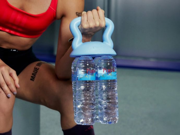 This Clip On Handle Turns Any Water Bottle Pack Into A Kettlebell