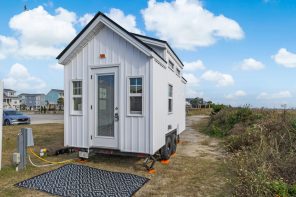This Tiny Home Packs a Full-Size Fridge, Loft Bedroom, & Sleeping for Four Into 128 Square Feet