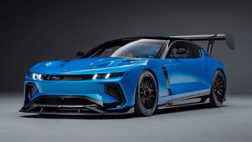 The GTX in Riviera blue, all splitter, vents, and a rear wing that towers over the roofline.