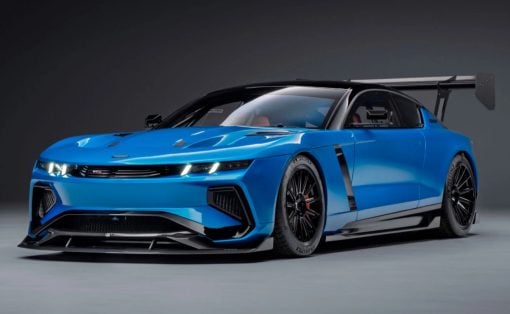 The GTX in Riviera blue, all splitter, vents, and a rear wing that towers over the roofline.