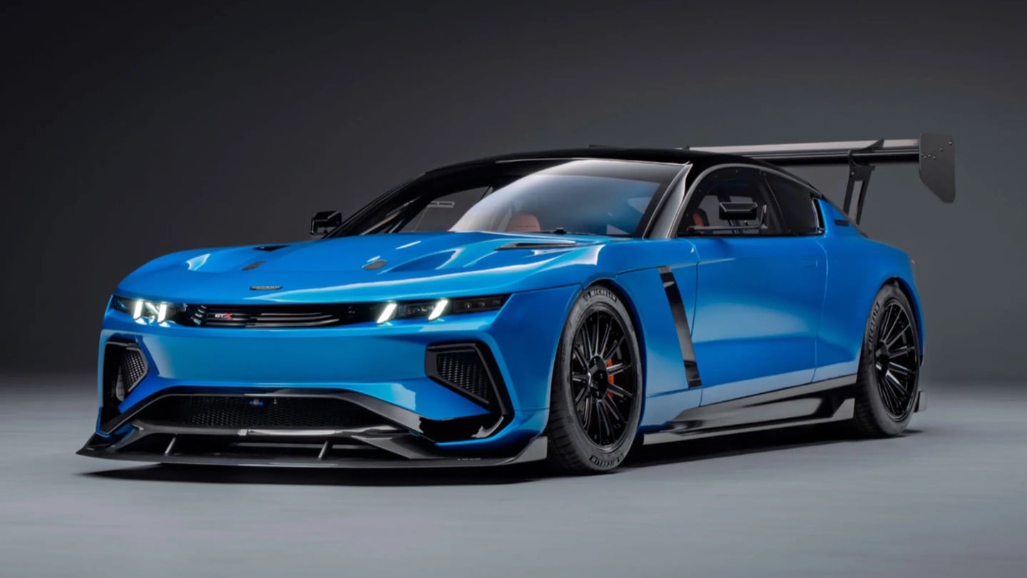 The GTX in Riviera blue, all splitter, vents, and a rear wing that towers over the roofline.