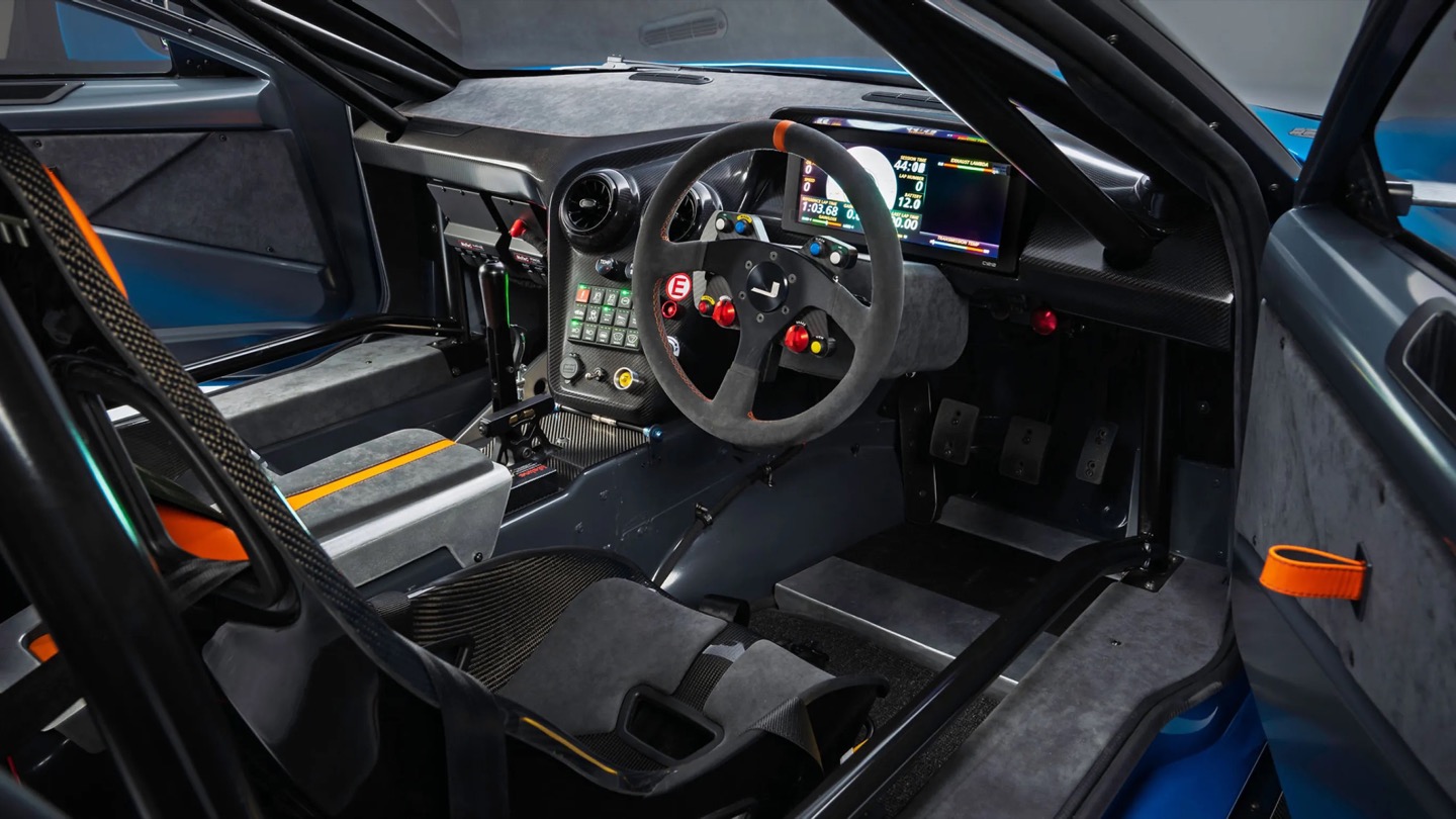 No screen, just a MoTeC dash, roll cage, and switchgear built for business.