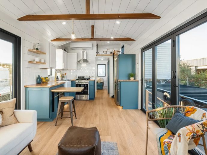 This Tiny Home Packs a Double Vanity, Trifold Glass Doors, & a Full Kitchen into 400 Square Feet