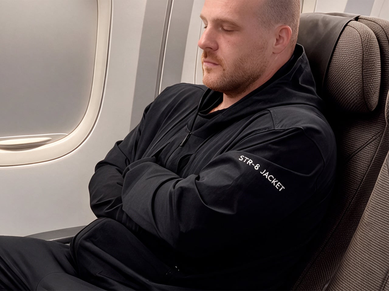 The Perfect ‘Frequent Flyer’ Hoodie cradles your arms like a Straightjacket for comfortable snoozing