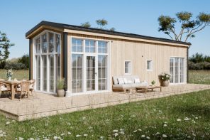 This Tiny Home Wraps Its Living Room in Glass and Keeps the Main Bedroom Downstairs